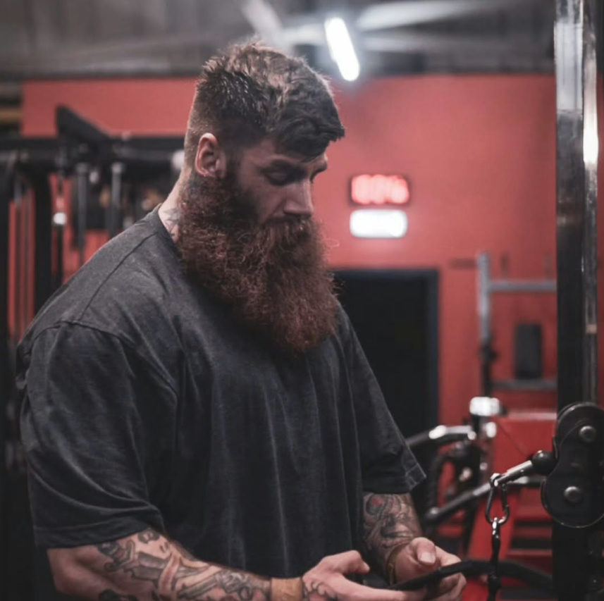 Adam checking in on the coaching app between sets